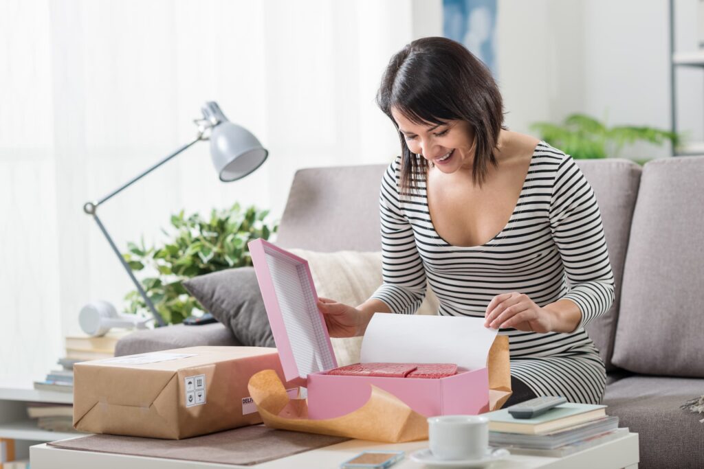 Woman unboxing a packaging box